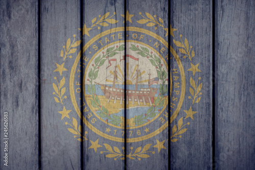 USA Politics News Concept: US State New Hampshire Flag Wooden Fence