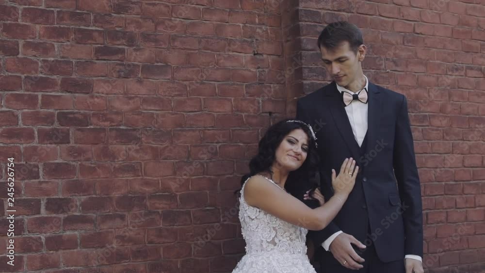 Young and beautiful wedding couple together. Lovely groom and bride. Wedding day. Slow motion Young and beautiful wedding couple together. Lovely groom and bride. Wedding day. Slow motion