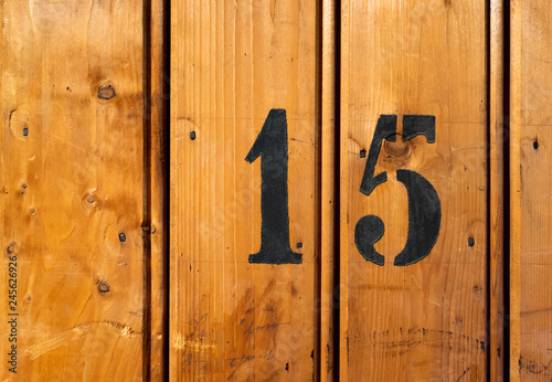 Photography number 15 on door of storage room for tenants in century-old apartment building