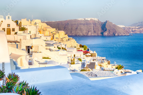 Romantic Destination. Tranquil Picturesque Cityscape of Oia Village on Santorini Island with Volcanic Caldera On Background Before Sunset