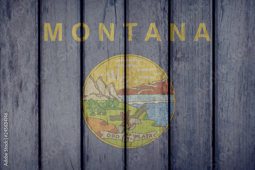 USA Politics News Concept: US State Montana Flag Wooden Fence photo