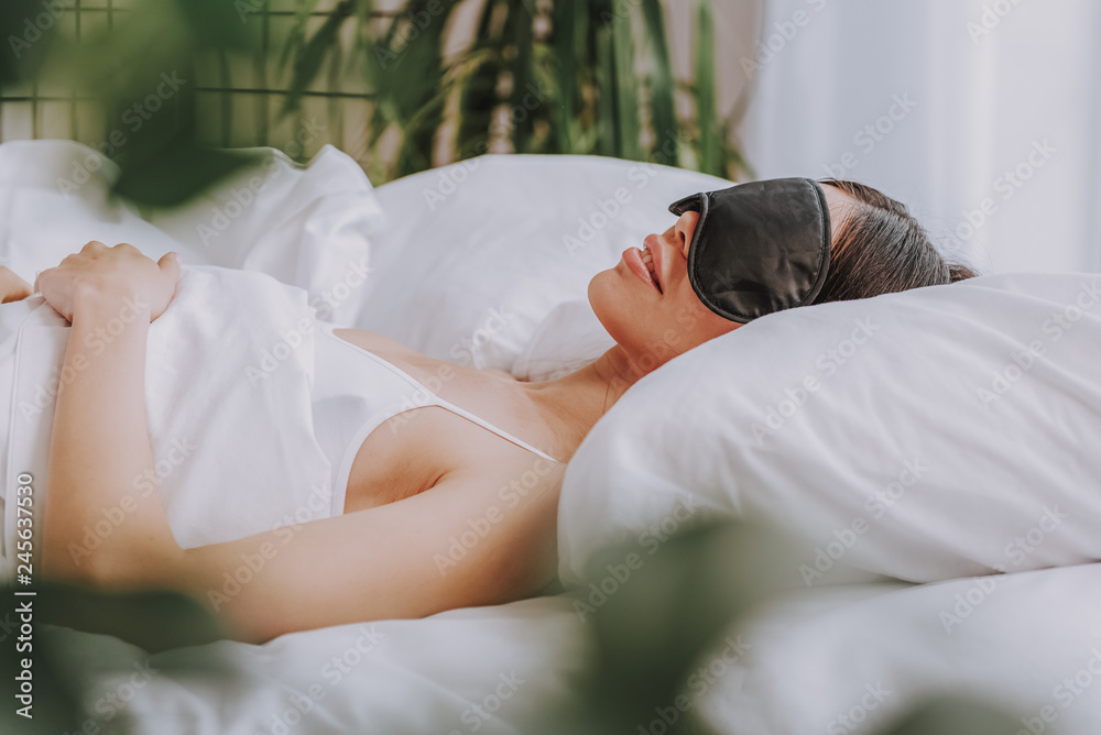Happy female dreaming in soft bed at home Happy female dreaming in soft bed at home