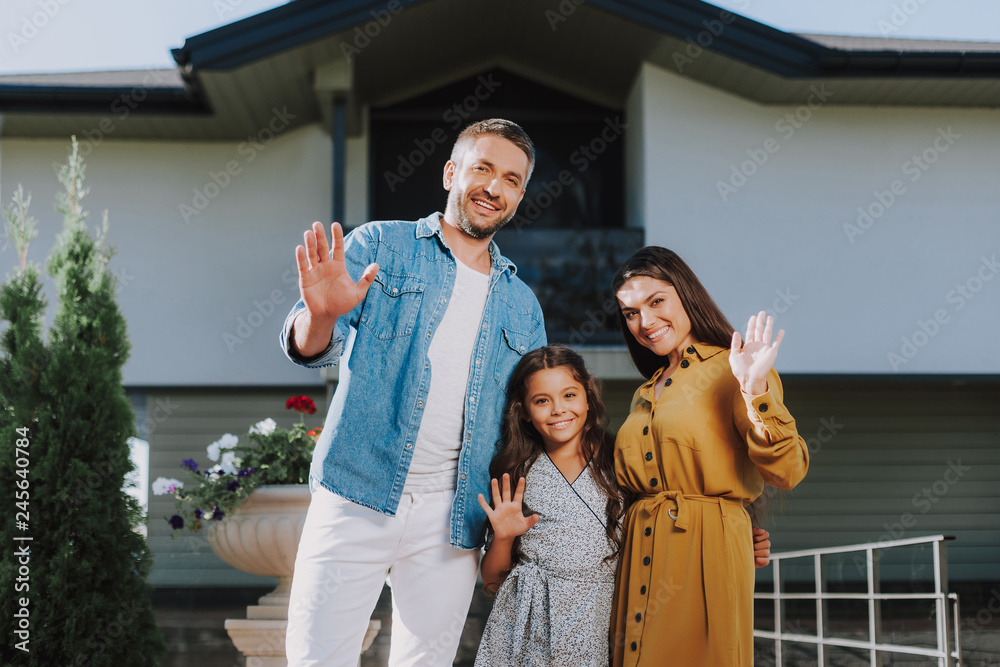 © Yakobchuk Olena - Happy family is locating near their home