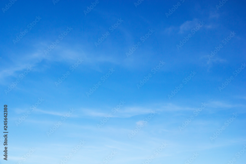 Fluffy blue sky background and white clouds soft focus, and copy space