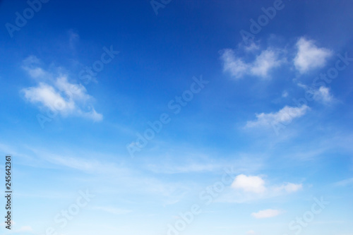 Blue sky background and white clouds soft focus, and copy space