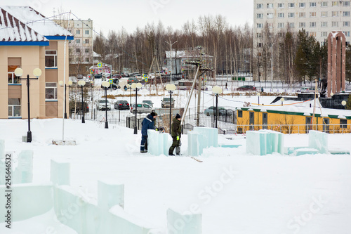 Installers at the construction of the ice town
