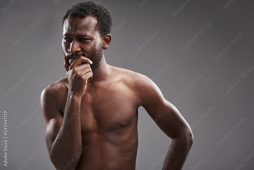 Serious afro American man thinking how to solve his problems