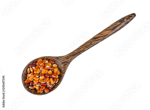 beans in wood spoon isolated on white background