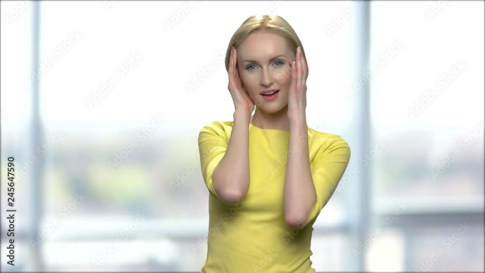 Middle-aged blonde woman flirting and seducing. Flirtatious woman in yellow blouse posing on blurred background. Ways to seduce your man. Stock Video | Adobe Stock