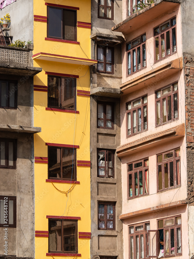 Yellow and brown old building facade at Kathmandu, Nepal.