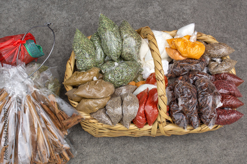 Basket with dried spices is on the pavement. Sell ​​on the streets of Quito. Ecuador.