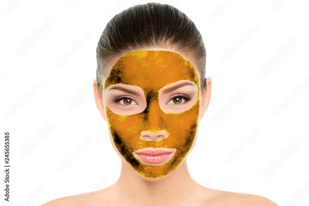 Gold mask luxury facial treatment for Asian women. Chinese beauty woman