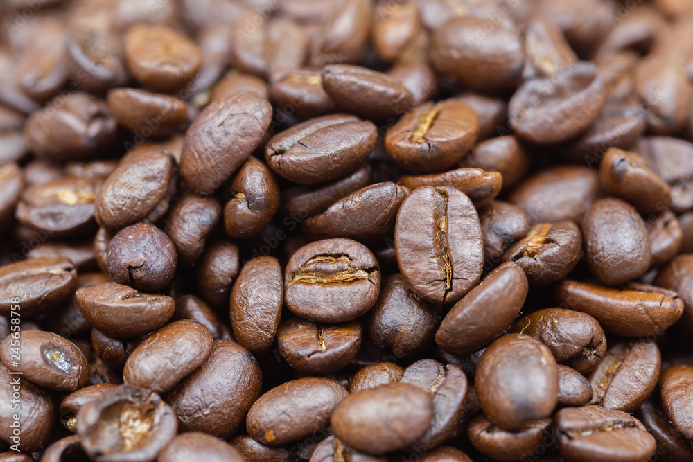 Fototapeta premium Brown roasted coffee beans texture background for food and drink or agriculture concept design.