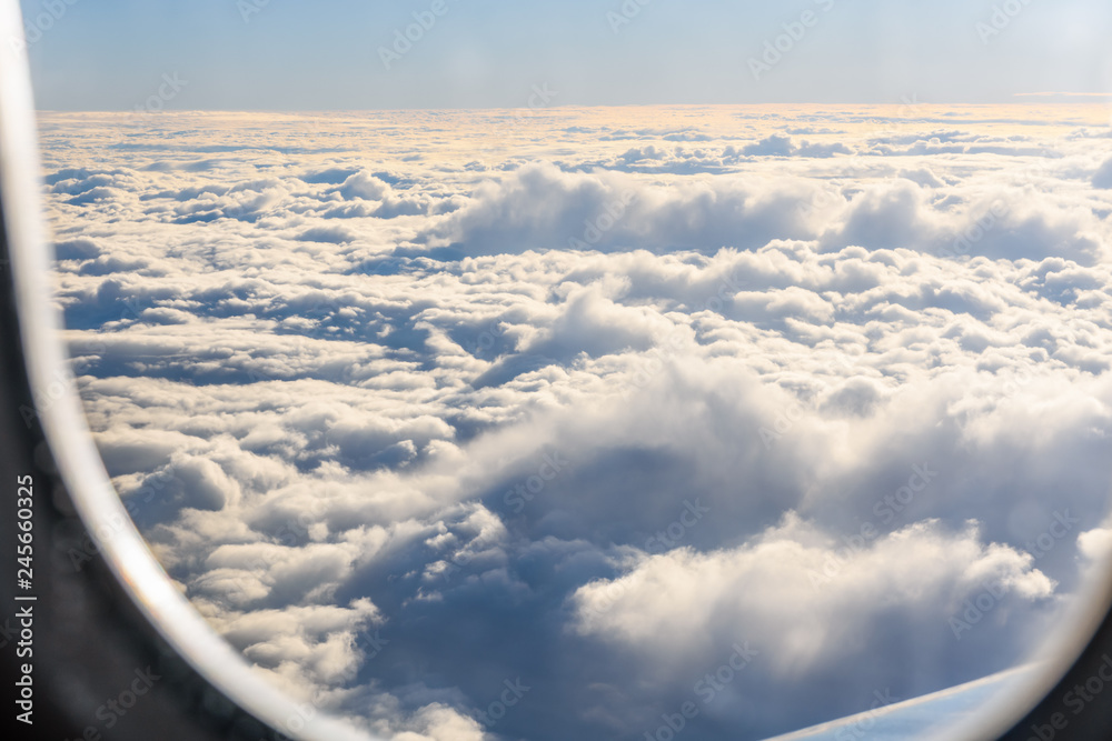 Naklejka premium View on white clouds from the airplane window