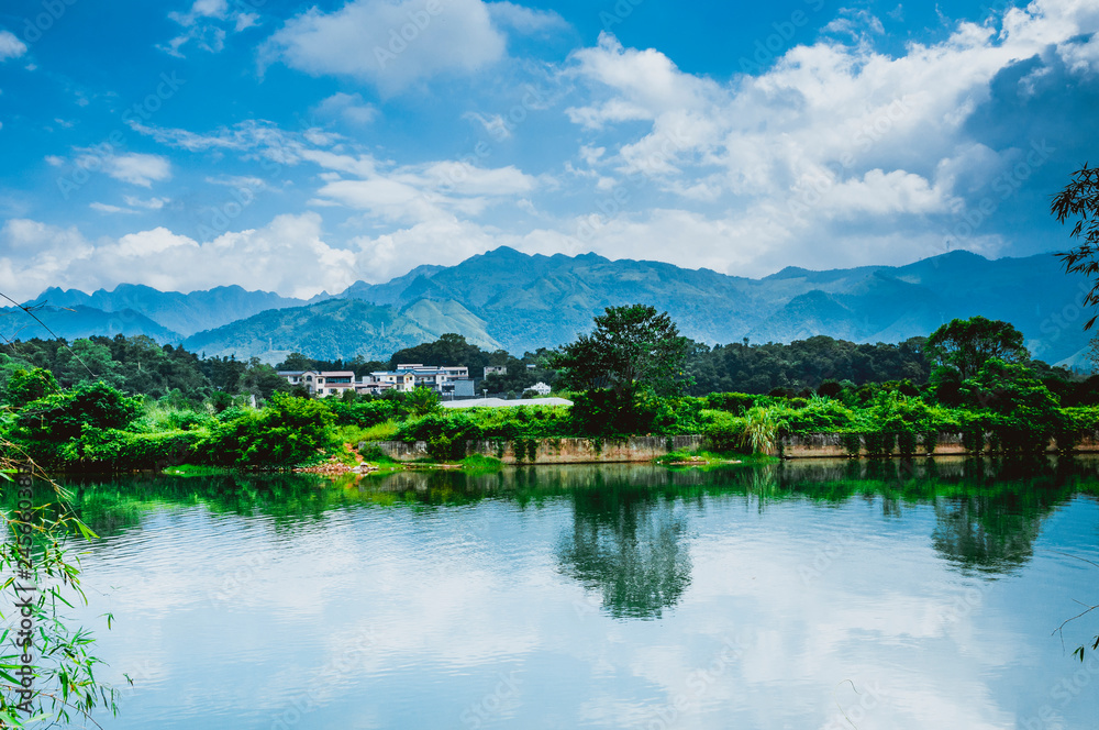Naklejka premium The river and mountains scenery in spring