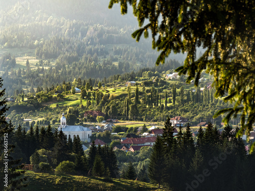 Sunset landscape in countryside. Lunca Ilvei village landscape view from up. Transylvania rural landscape in the mountains.