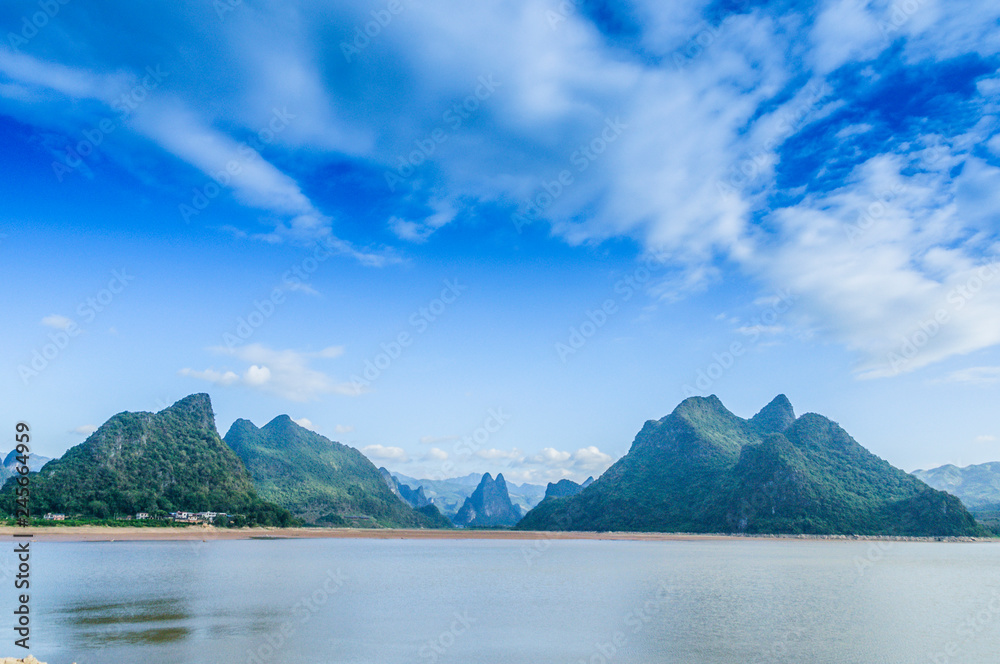 The mountains and river scenery with blue sky 