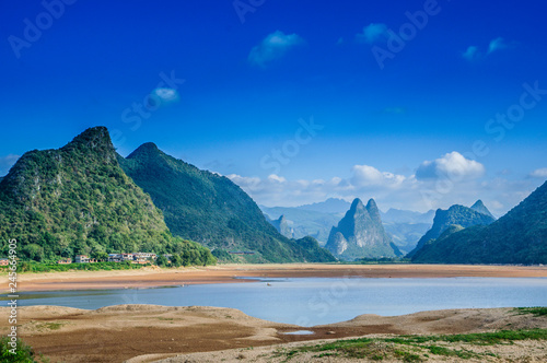 The mountains and river scenery with blue sky 