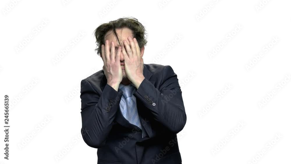 Desperate mature businessman on white background. Depressed caucasian entrepreneur. Unemployment and business failure concept. Desperate mature businessman on white background. Depressed caucasian entrepreneur. Unemployment and business failure concept.