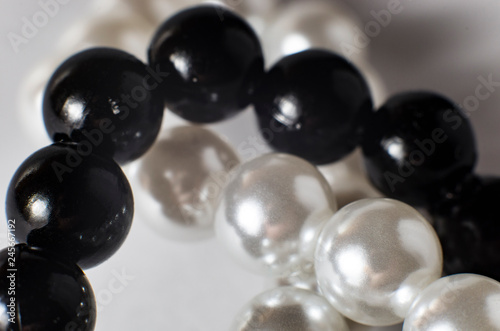 White and black pearls in a necklace, large