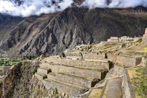 Cusco, Peru - Oct 22, 2018: Stone buildings and terraces at the Ollantaytambo archaeological site in the Sacred Valley photo