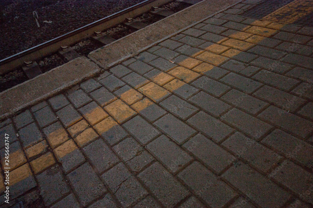 Fototapeta premium paving with yellow line at the station