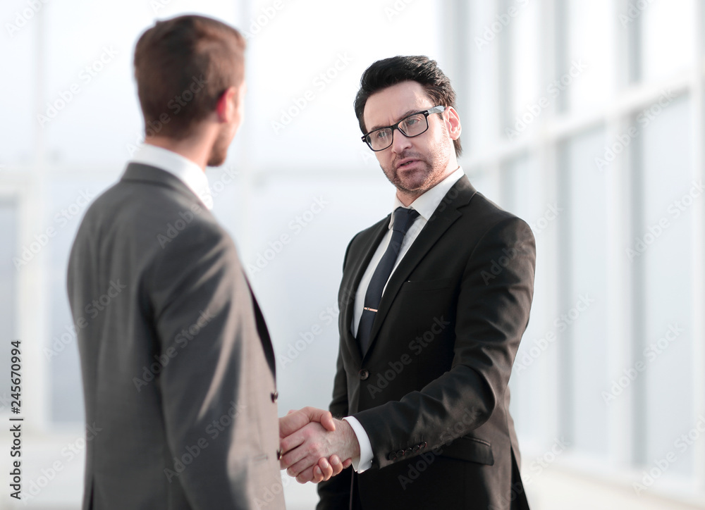friendly handshake of business partners friendly handshake of business partners