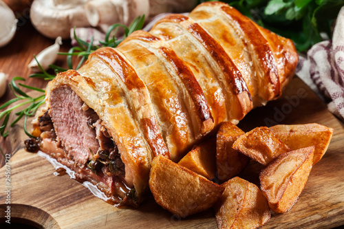 Pork tenderloin in wellington style in puff pastry photo