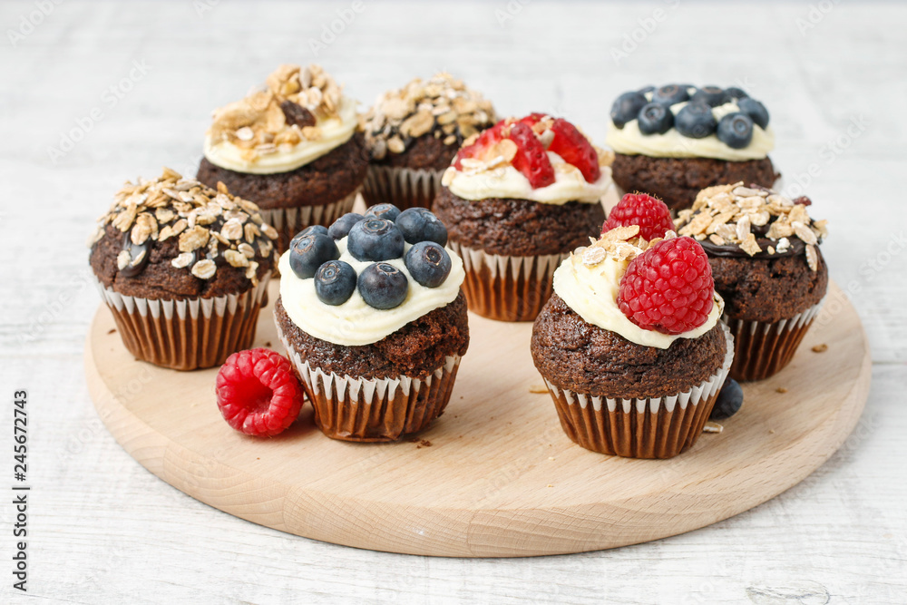 Muffins decorated with fresh fruits