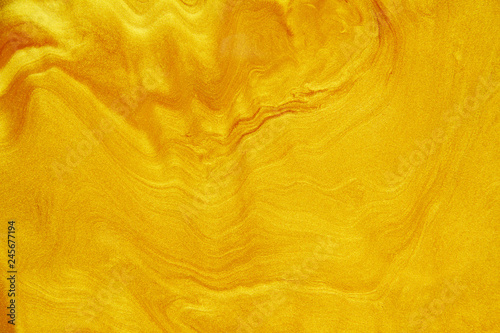 Golden acrylic background texture.