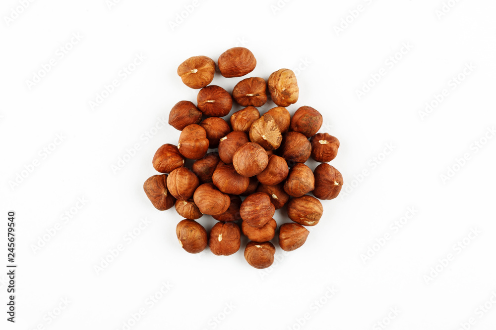 Pile of raw hazelnut on a white background Pile of raw hazelnut on a white background