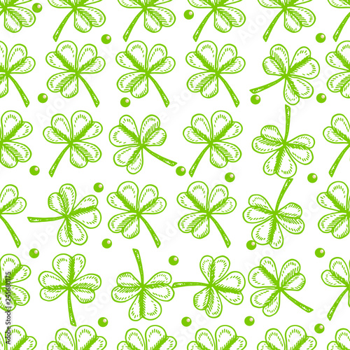 St. Patrick's Day background. Vector seamless pattern with irish symbols of St. Patrick' s holiday such as green shamrock leaves
