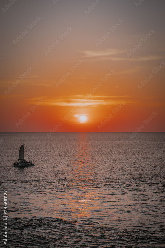 Fototapeta premium Boat sailing during beautiful sunset, Thailand