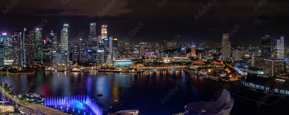 super wide panorama of Singapore skyscrapers at night