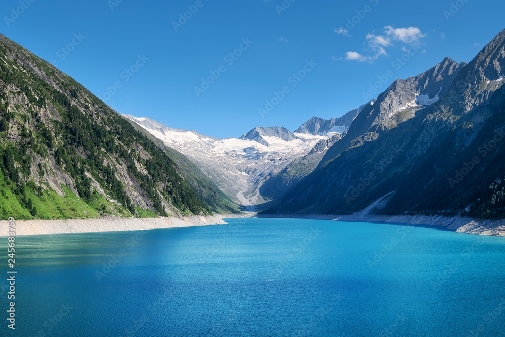 Obraz premium Mountain lake in Austria. High mountains region at the day time. Natural landscape in Austria mountains. Austria landscape - image