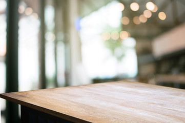empty wood table with blur montage restaurant background