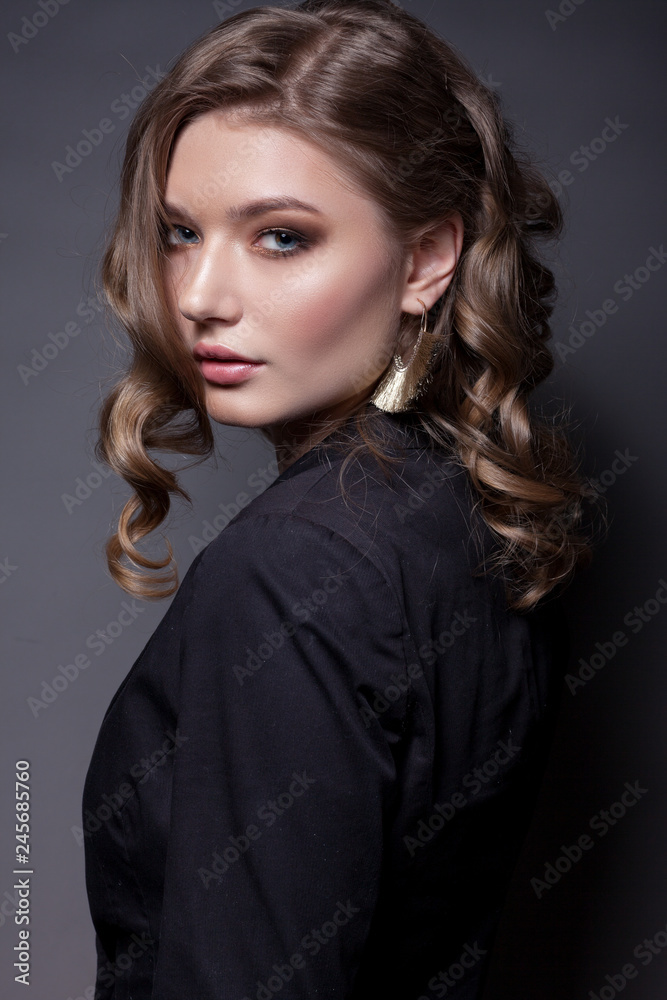 Portrait of a beautiful woman in a black jacket. Portrait of a beautiful woman in a black jacket.