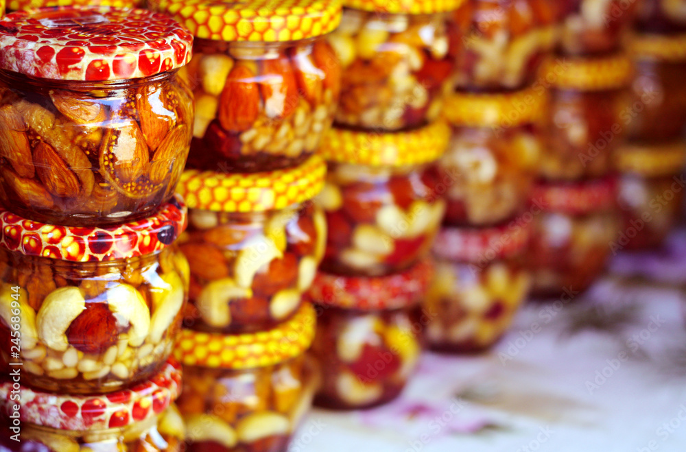 Honey with nuts in the jars