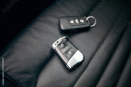 Car ignition key at leather seats photo