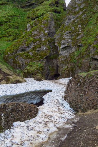 Snow blocking the entrance of Rauðfeldsgjá canyon near Budir, Snæfellsnes peninsula, Iceland photo