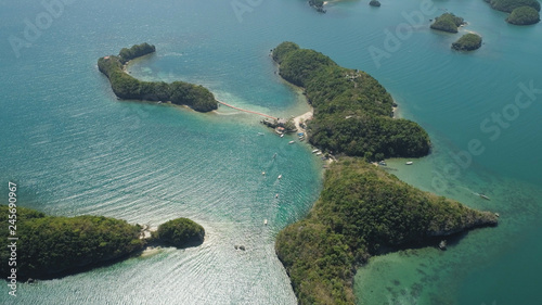 Aerial view of Small islands with beaches and lagoons in Hundred Islands National Park, Pangasinan, Philippines. Famous tourist attraction, Alaminos. © Alex Traveler