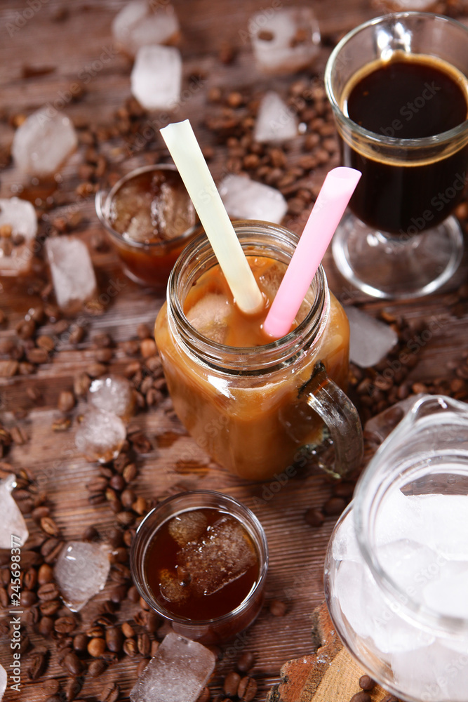 A can of coffee and two drinking tubes. The concept of still life on wooden background. A can of coffee and two drinking tubes. The concept of still life on wooden background.