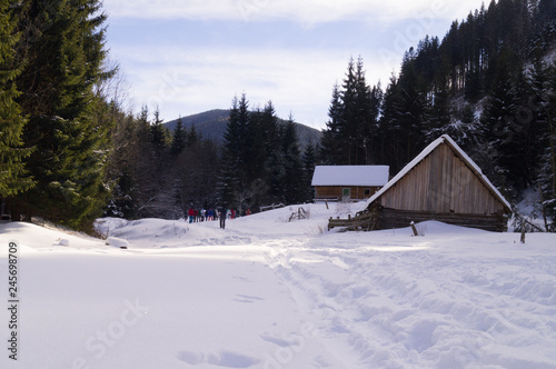 Winter adventures. Wooden hut. Carpathians. Ukraine.