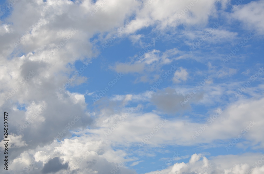 Day light and blue sky with fluffy clouds. Beautiful cloudscape Day light and blue sky with fluffy clouds. Beautiful cloudscape