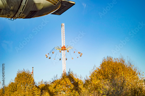 Flying swing ride near london eye in park photo