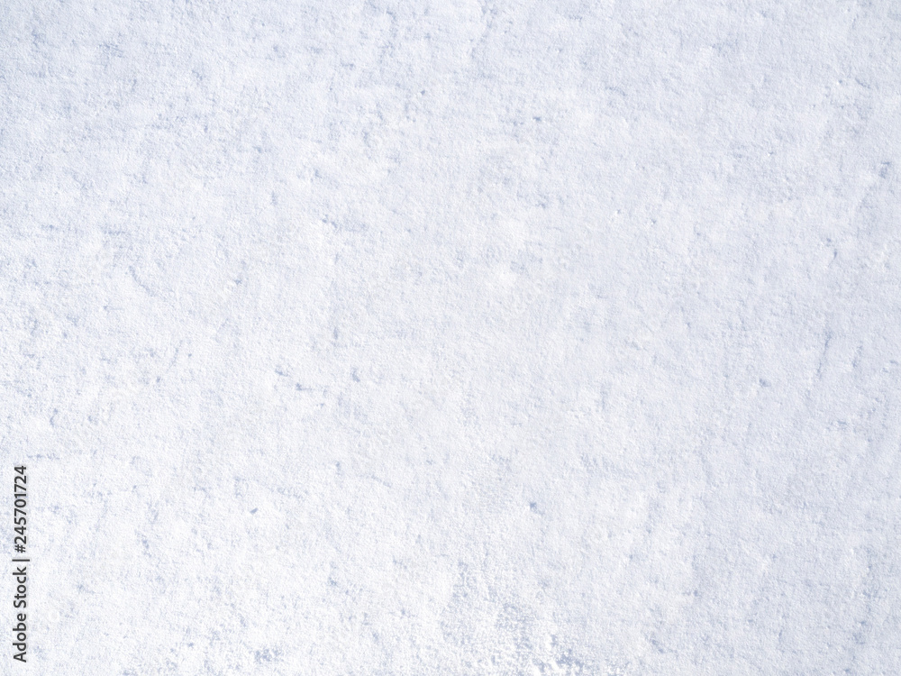 Naklejka premium texture of white fresh snow sparkling in the sun, natural winter background