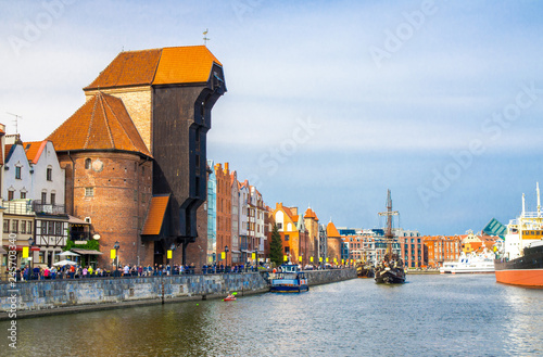 Zuraw Crane and colorful buildings on Motlawa river, Gdansk, Poland photo