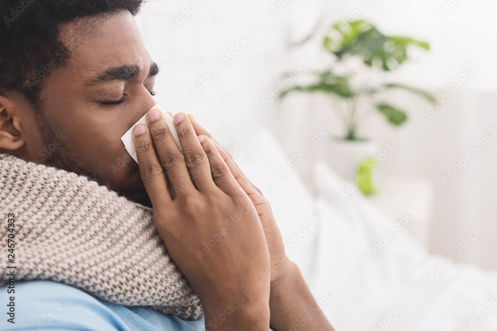 African-american man man has runny nose at home African-american man man has runny nose at home
