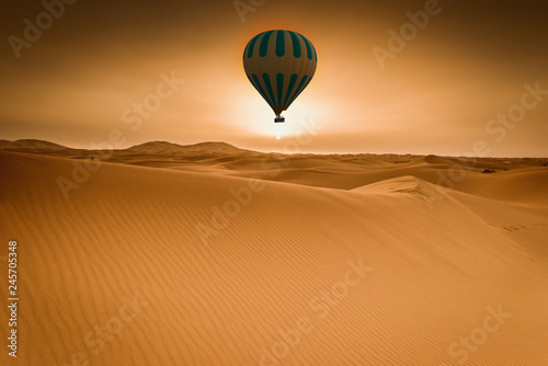 Desert and hot air balloon Landscape at Sunrise.
