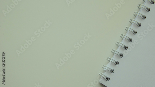 spiral notebook and pen
